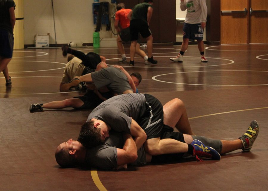 Junior Ryan Yarnell practicing with Coach Ryan Bollinger on the first practice of the year.