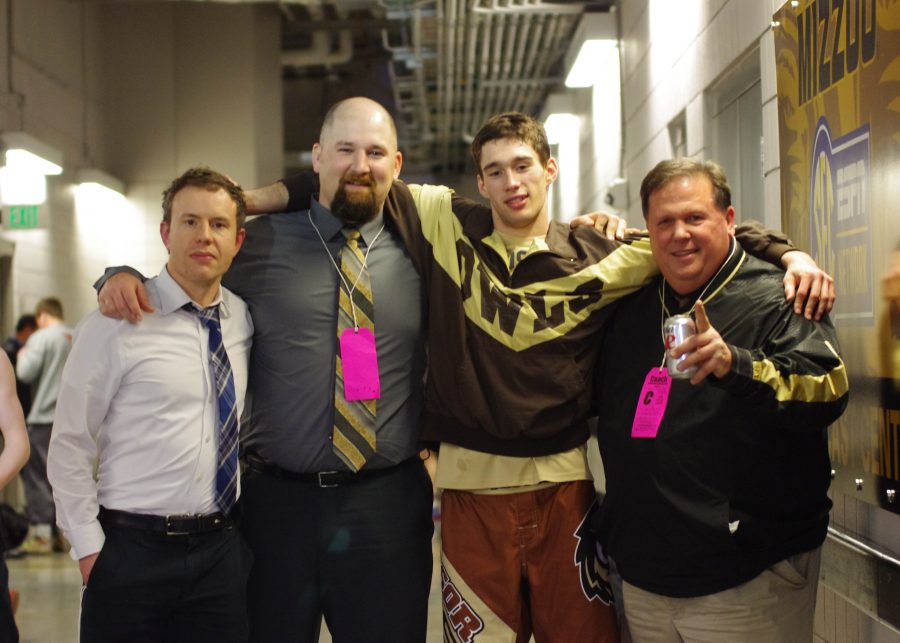 (From left) Tom Ford, Ryan Bollinger, Jake Warren and Kevin Stoffey celebrate after Warren brought home the program's first state title. 