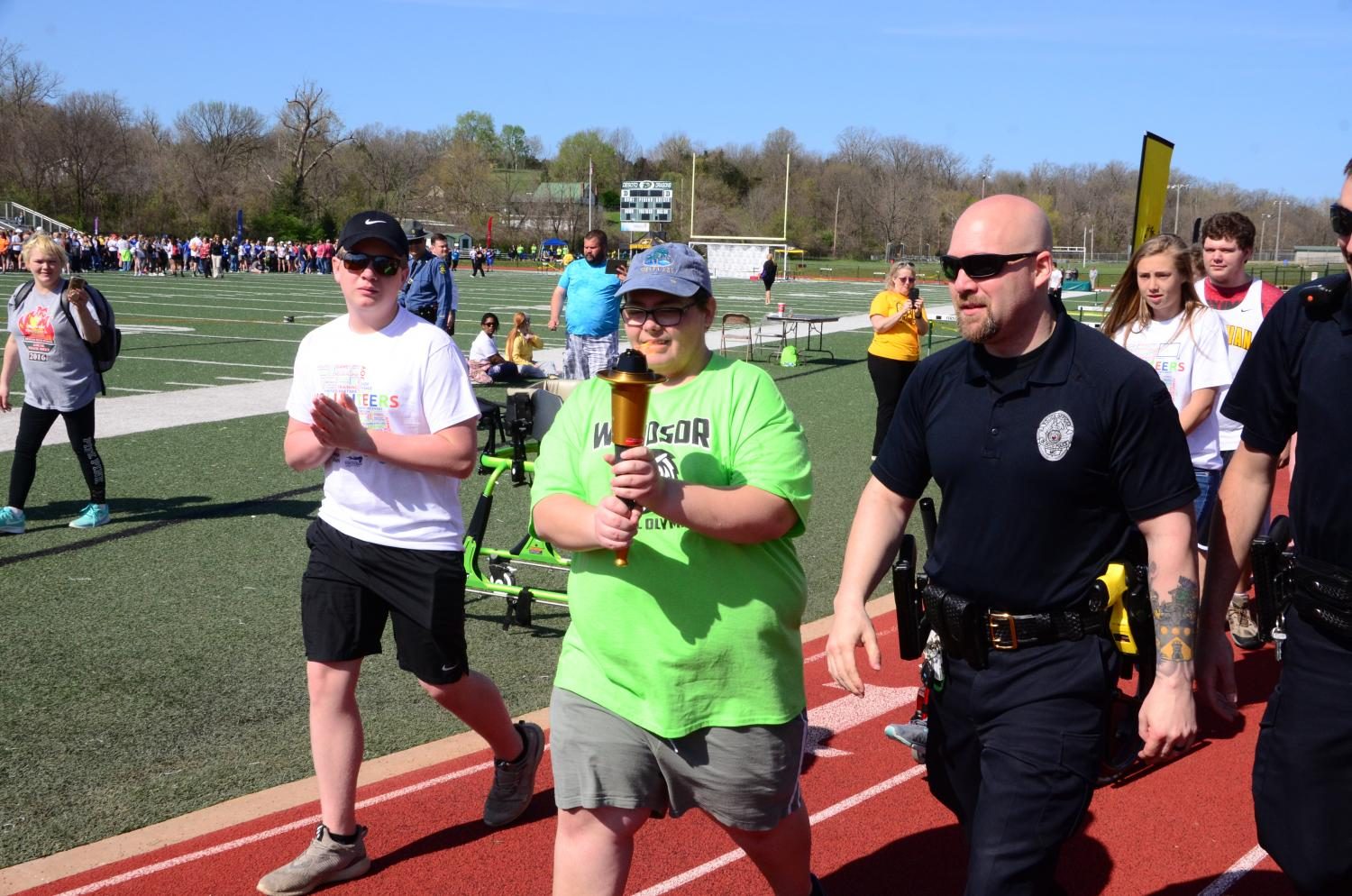 Sean Rice carries the torch for the opening ceremonies at the 2017 Spring Special Olympics in DeSoto. 