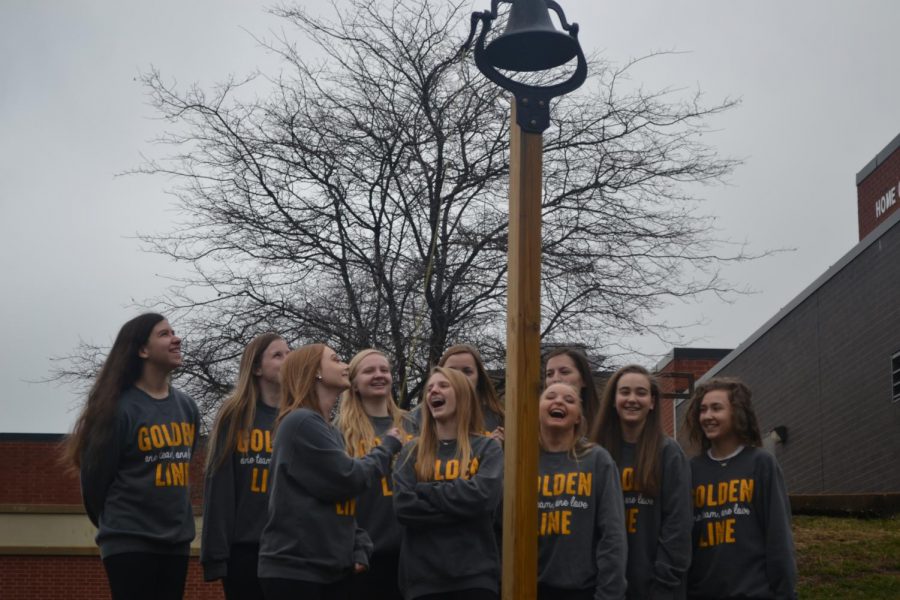 The team enjoyed ringing the bell. 