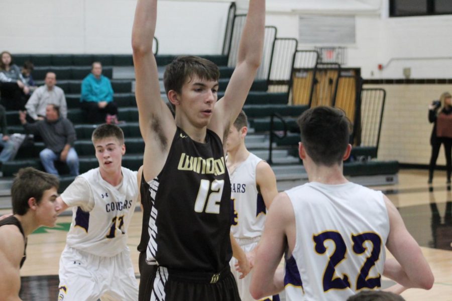 Evan Worley defends an out-of-bounds play.