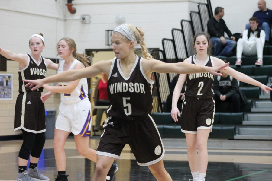 Maddy Lynch, Keri Voegtle, and Biz Spurgeon defend their opponents.