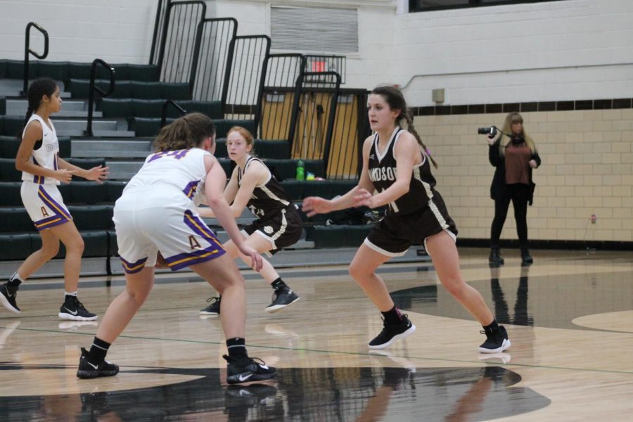 Madi Miller and Isabella Spurgeon defend their opponents.