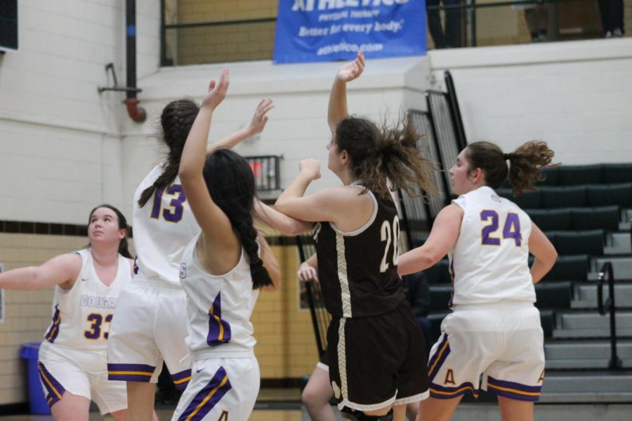 Mary Creed scores a basket.