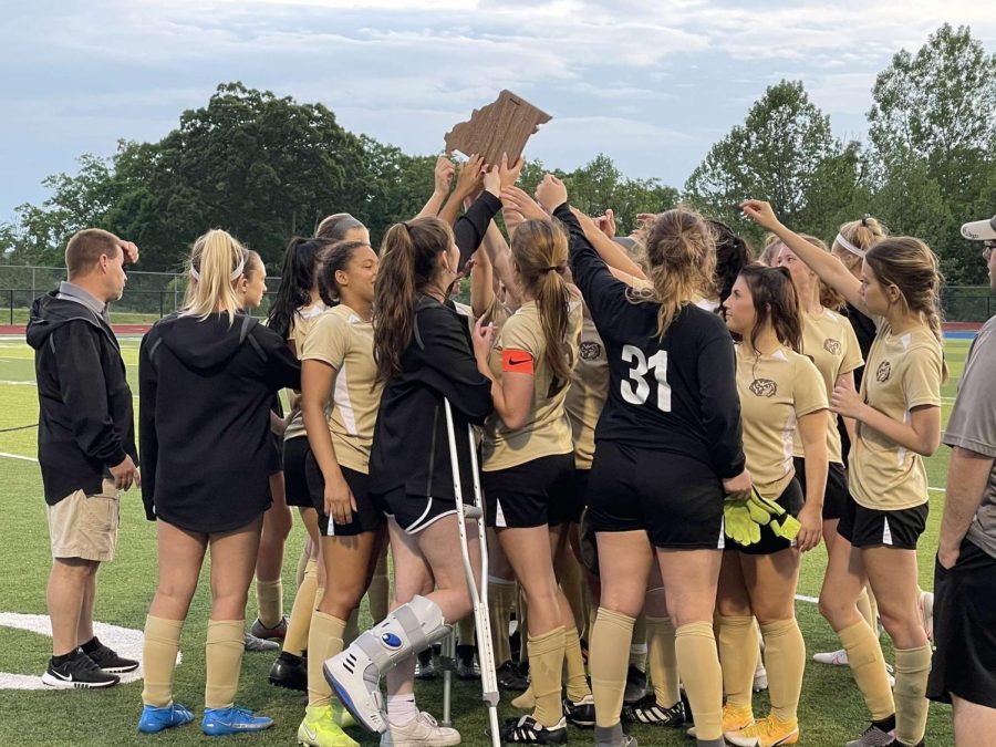 The soccer team won a district championship last season. 