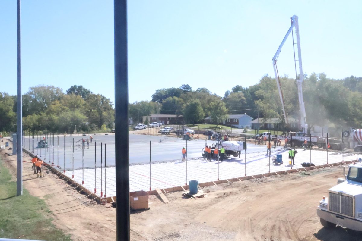 Workers began pouring concrete on the 5 new tennis courts that are being constructed. 